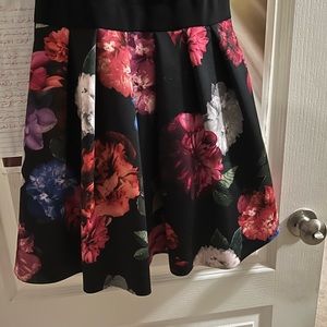 Size 2 puffy dress black on top and flower style on the bottom